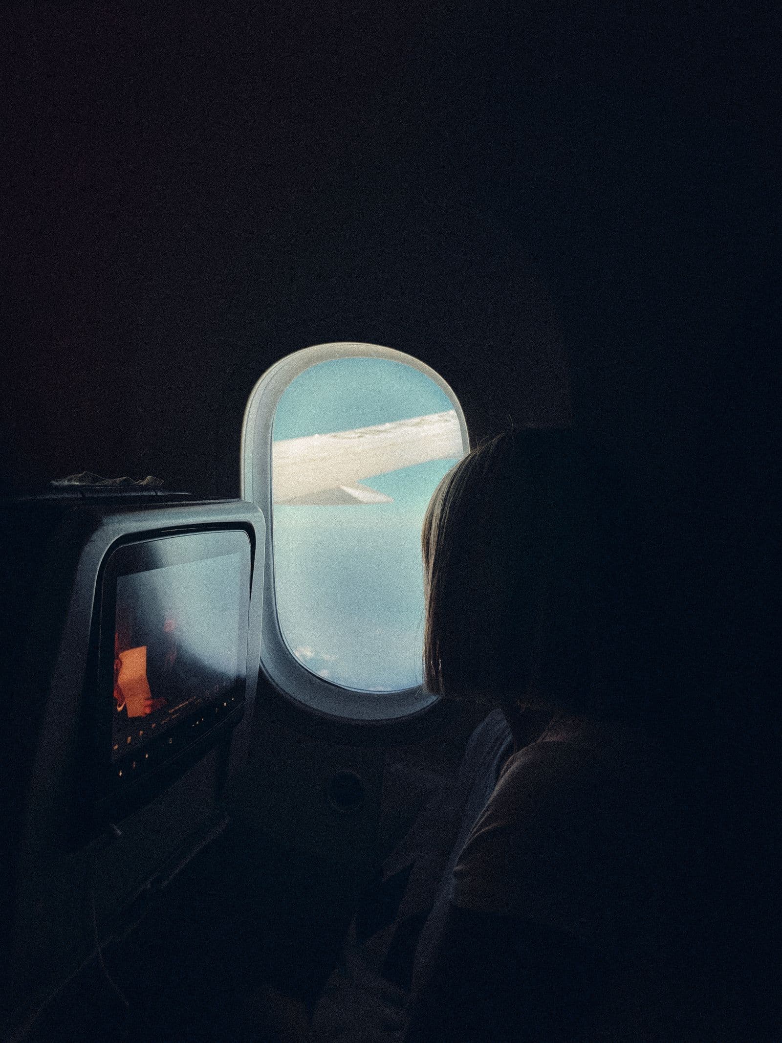 Passenger cabin and window during a flight