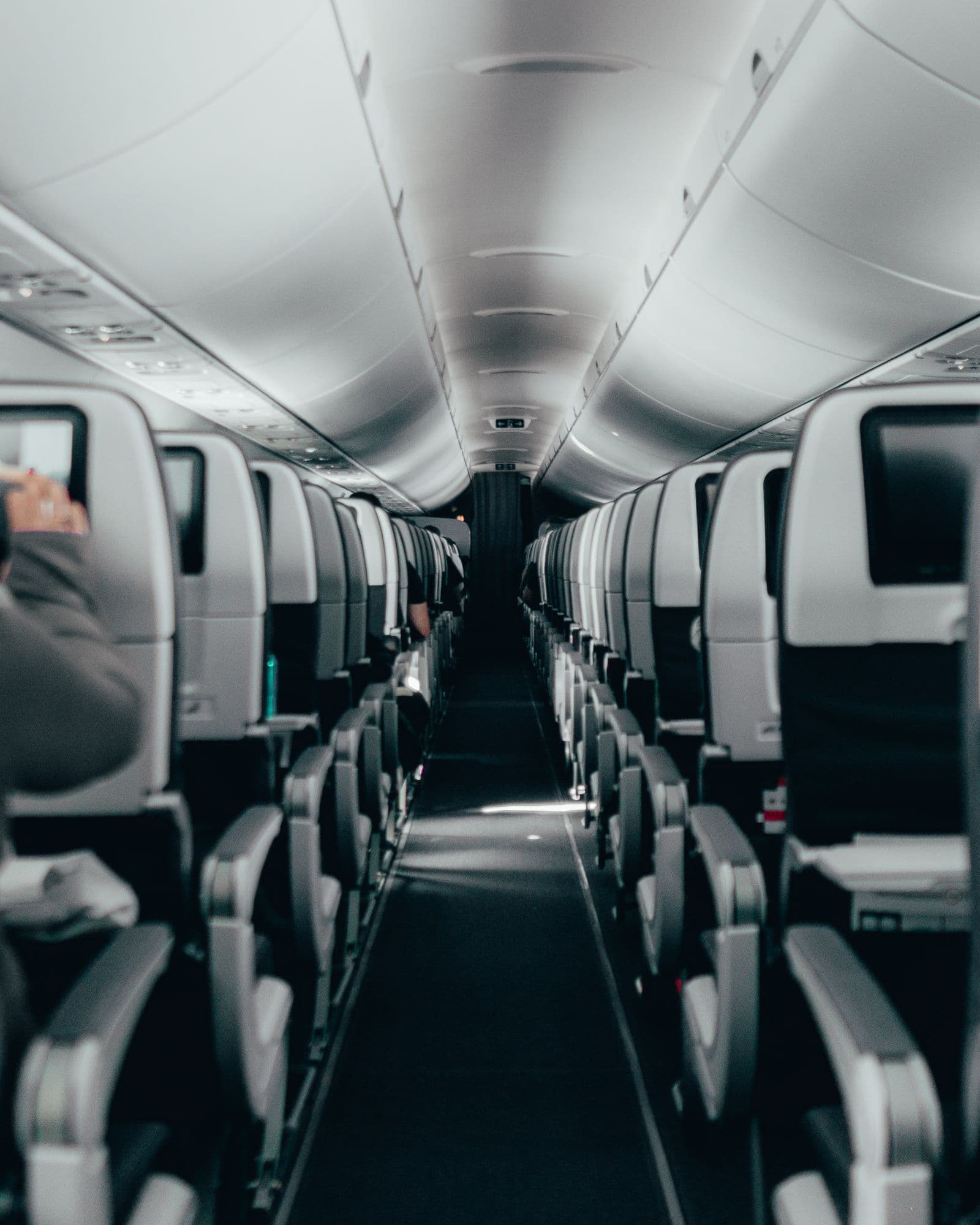 Modern airplane cabin with rows of passenger seats