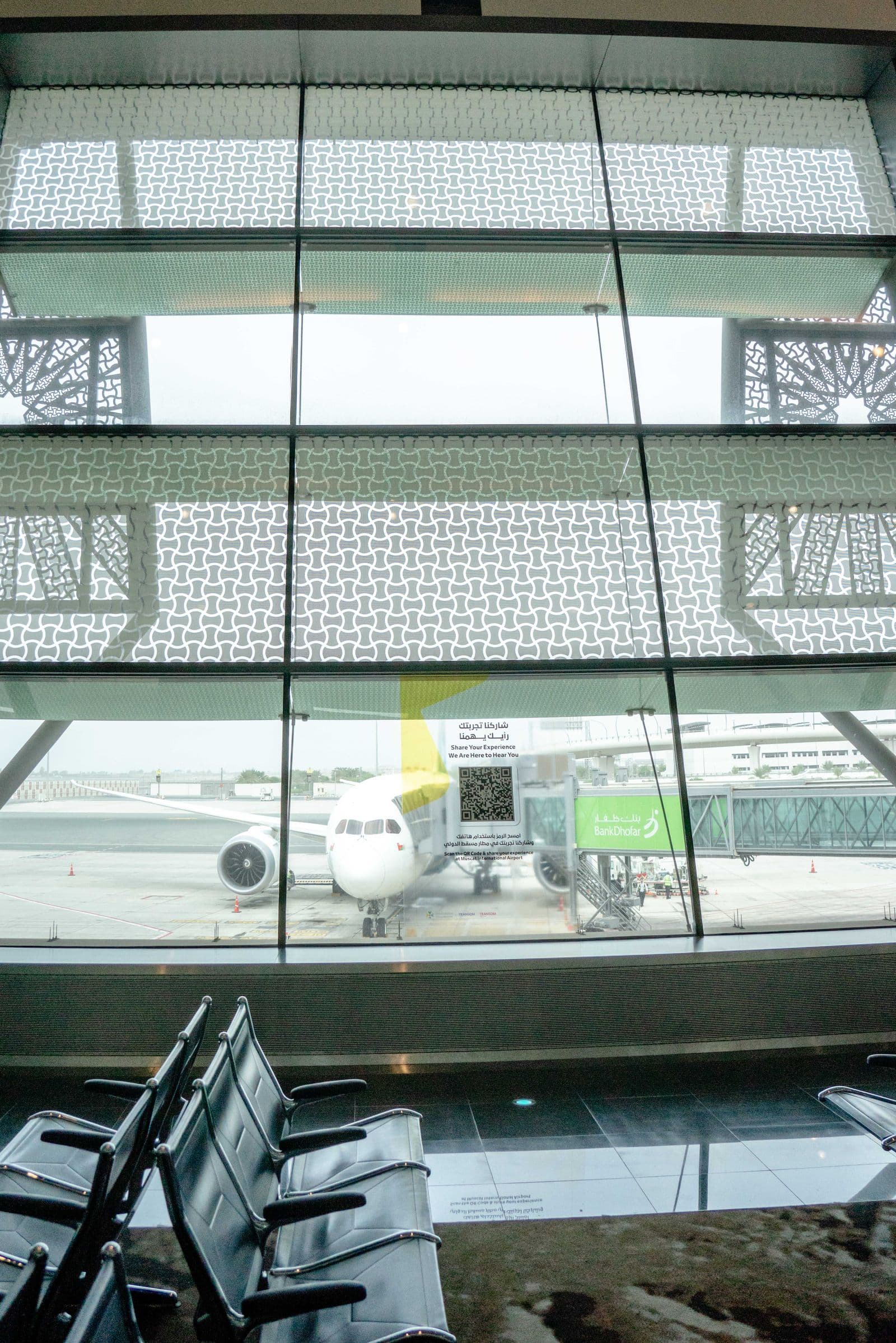 Airport waiting area overlooking an aircraft at the gate