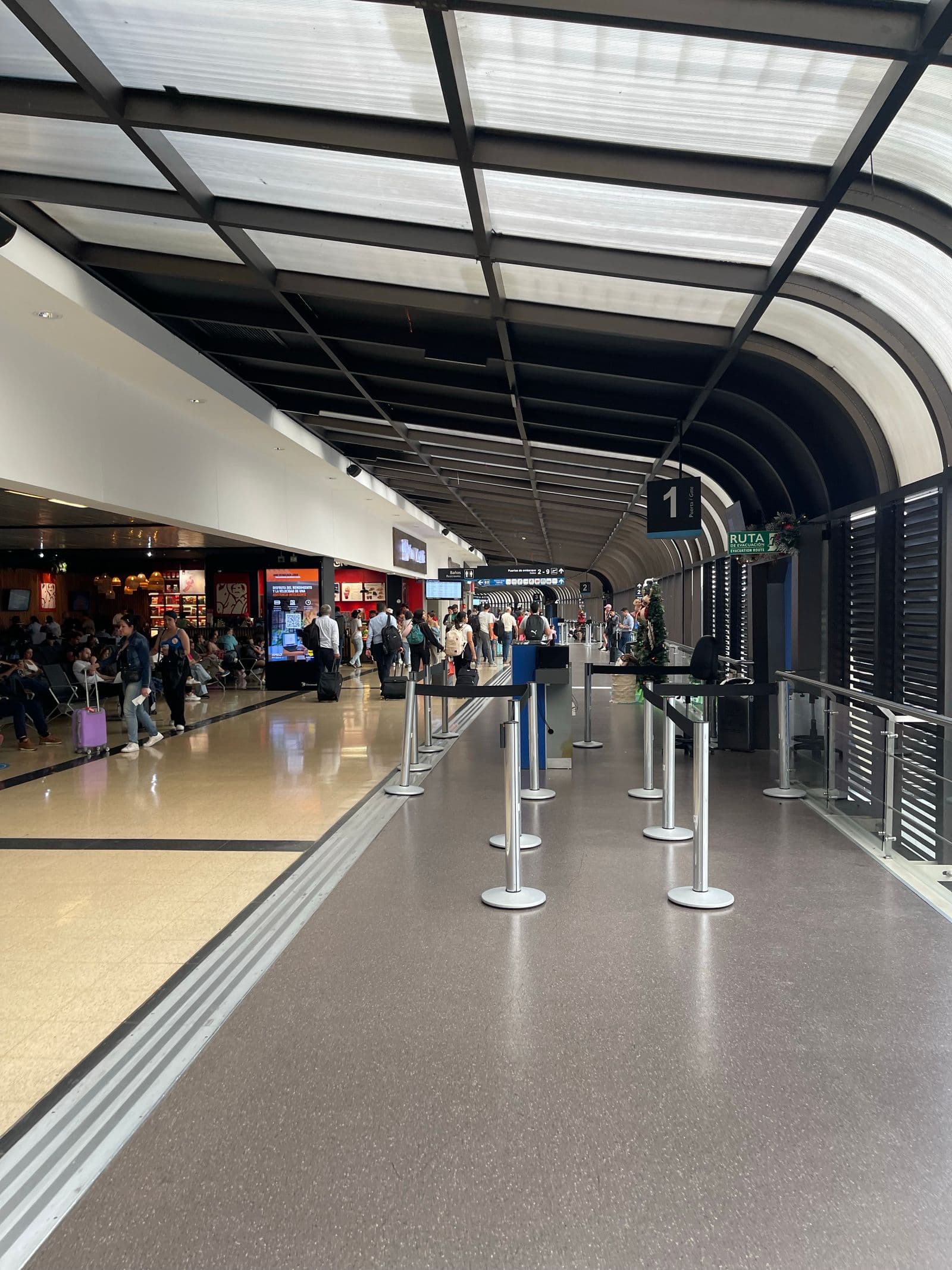 Busy airport terminal with travelers and departure gates