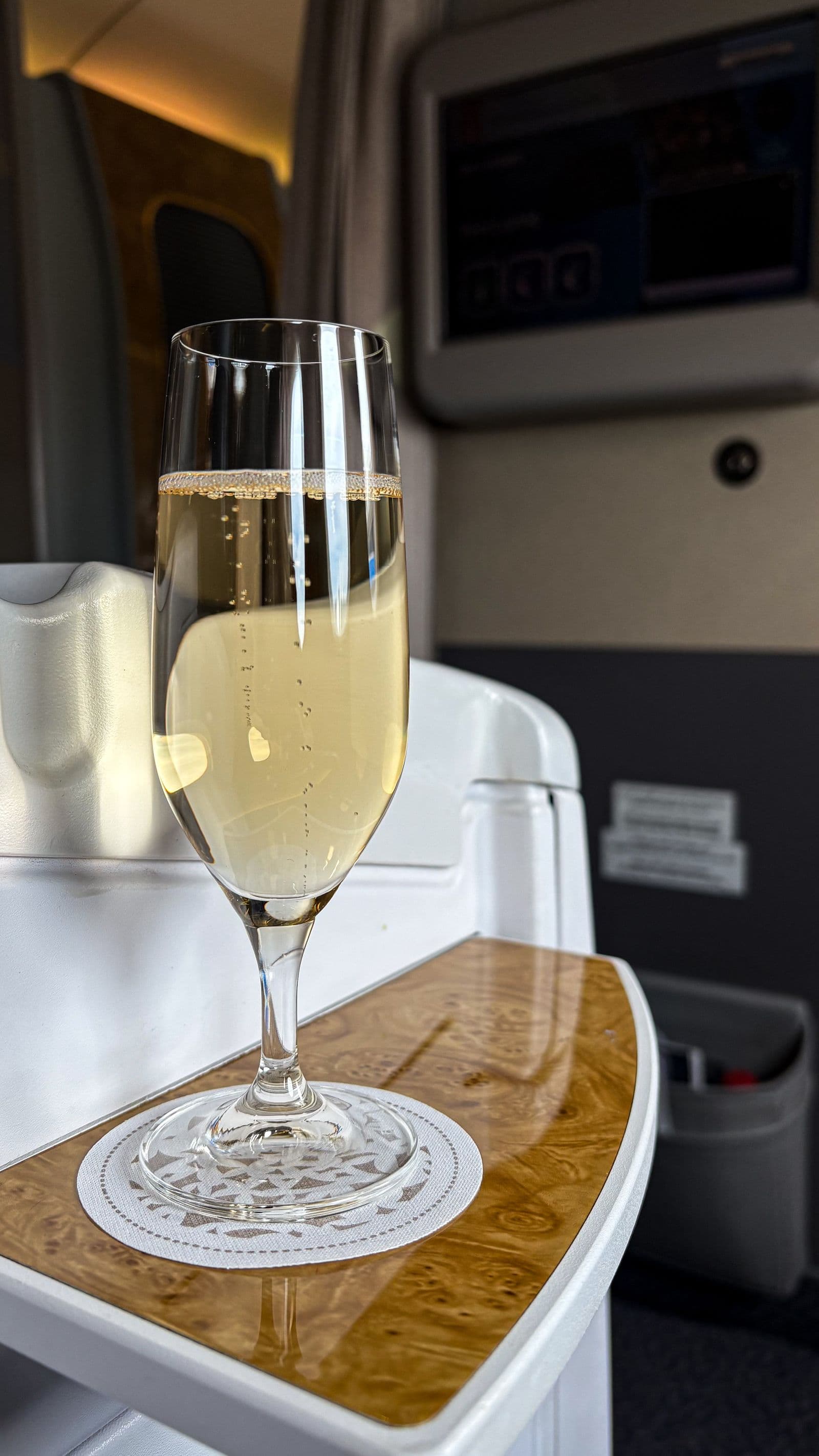 Champagne served in a premium aircraft cabin