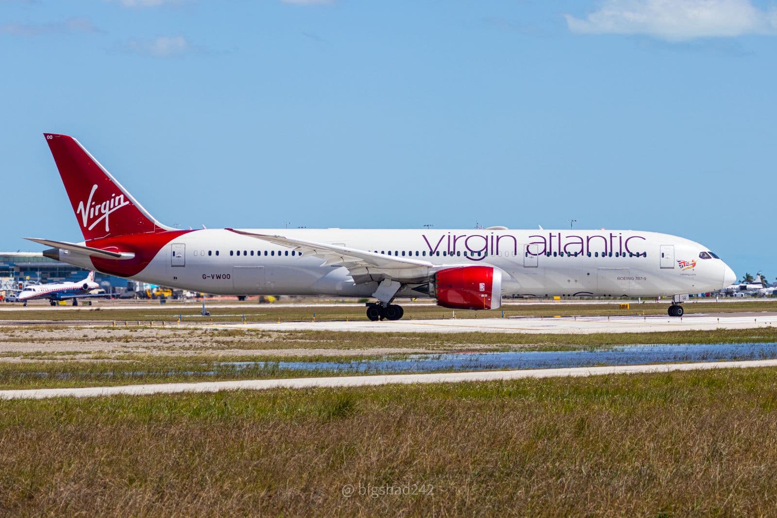 Virgin Atlantic Boeing 787-9 taxiing at an airport under a blue sky