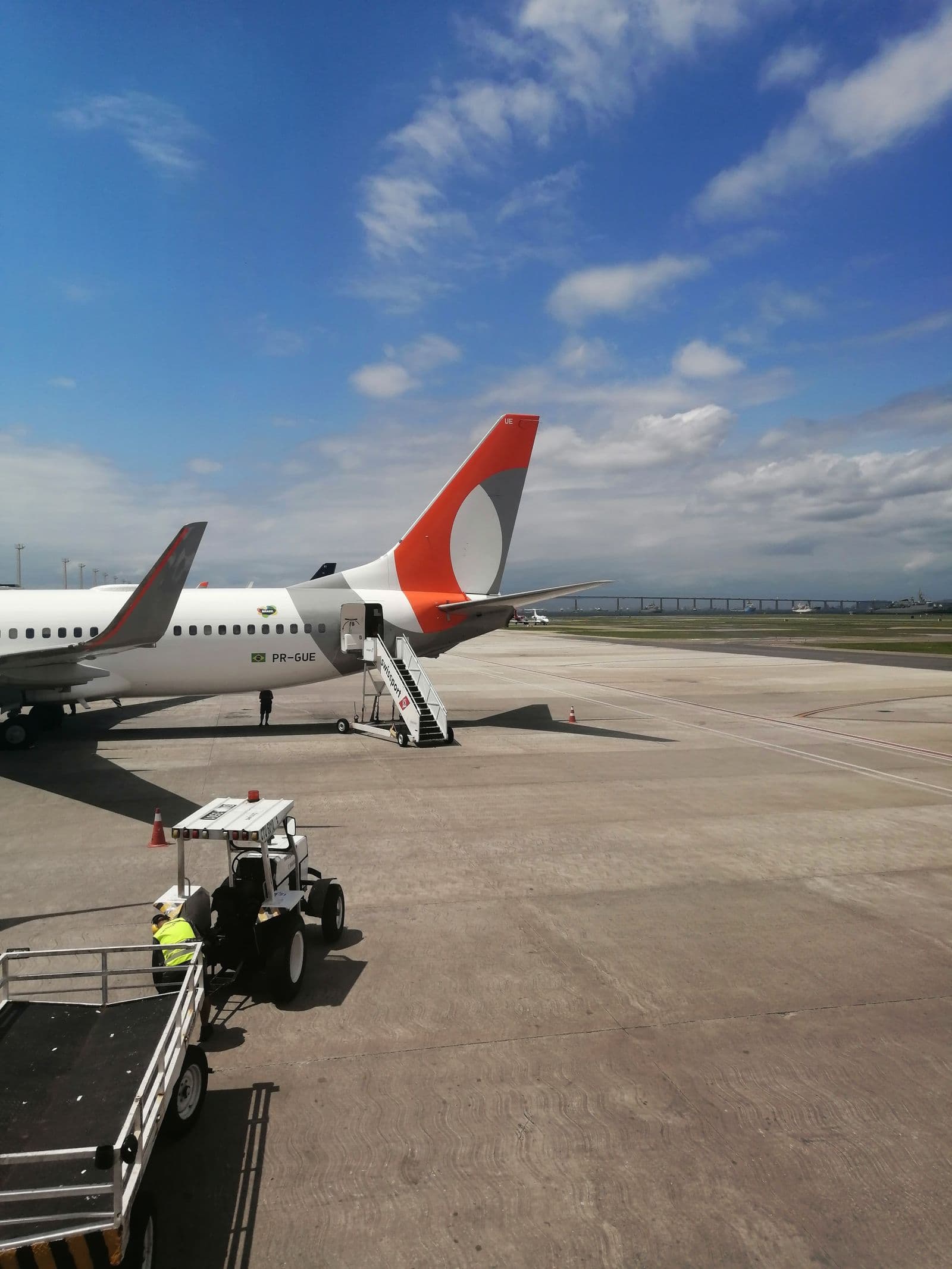 Commercial airplane being serviced on an airport apron