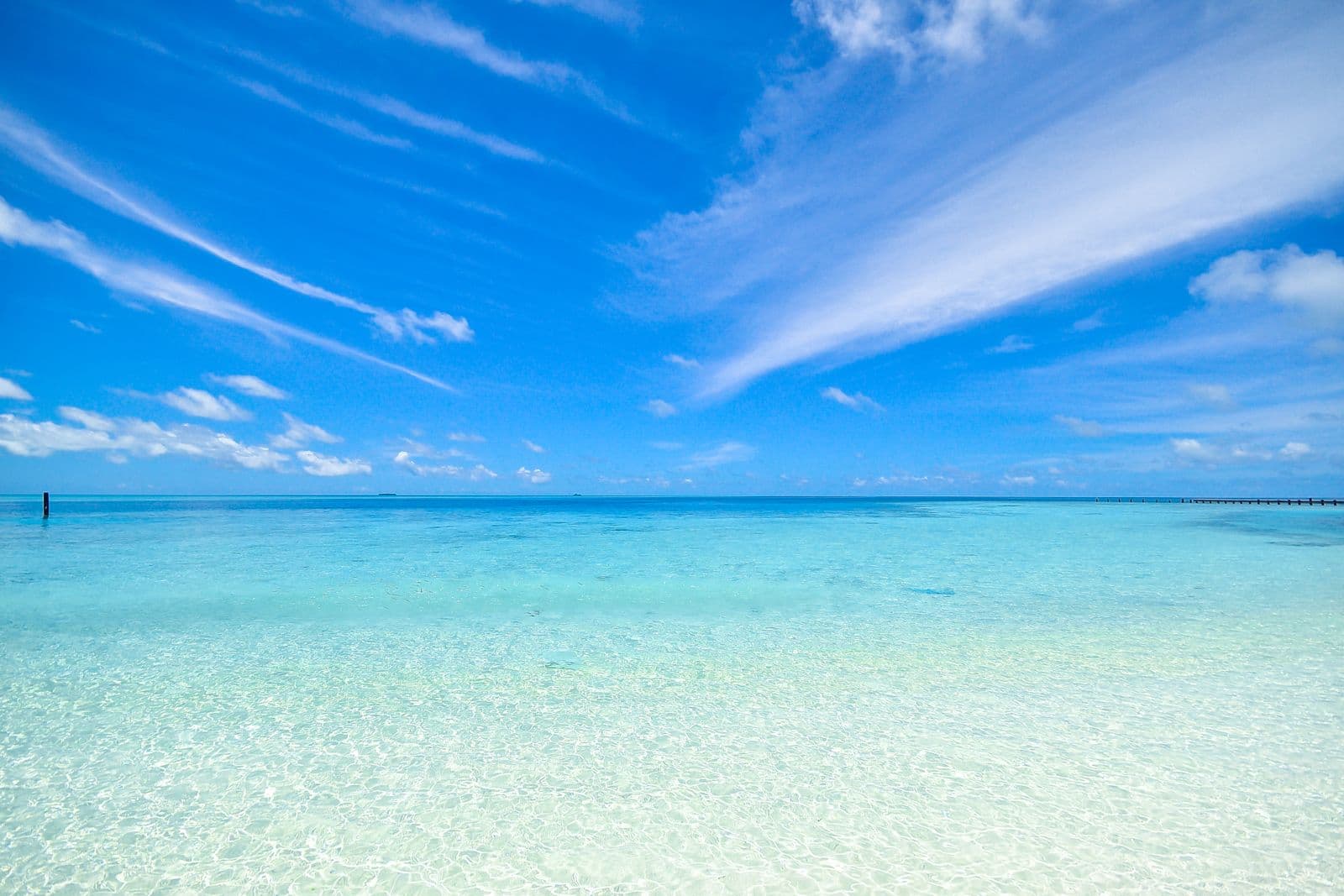 Clear turquoise ocean under a tropical sky