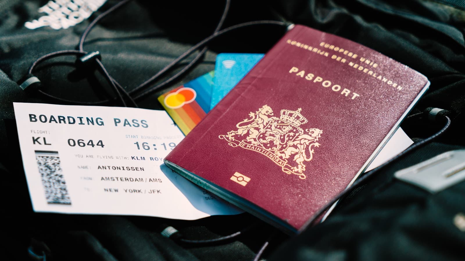 Passport, boarding pass, and payment card prepared for an international flight