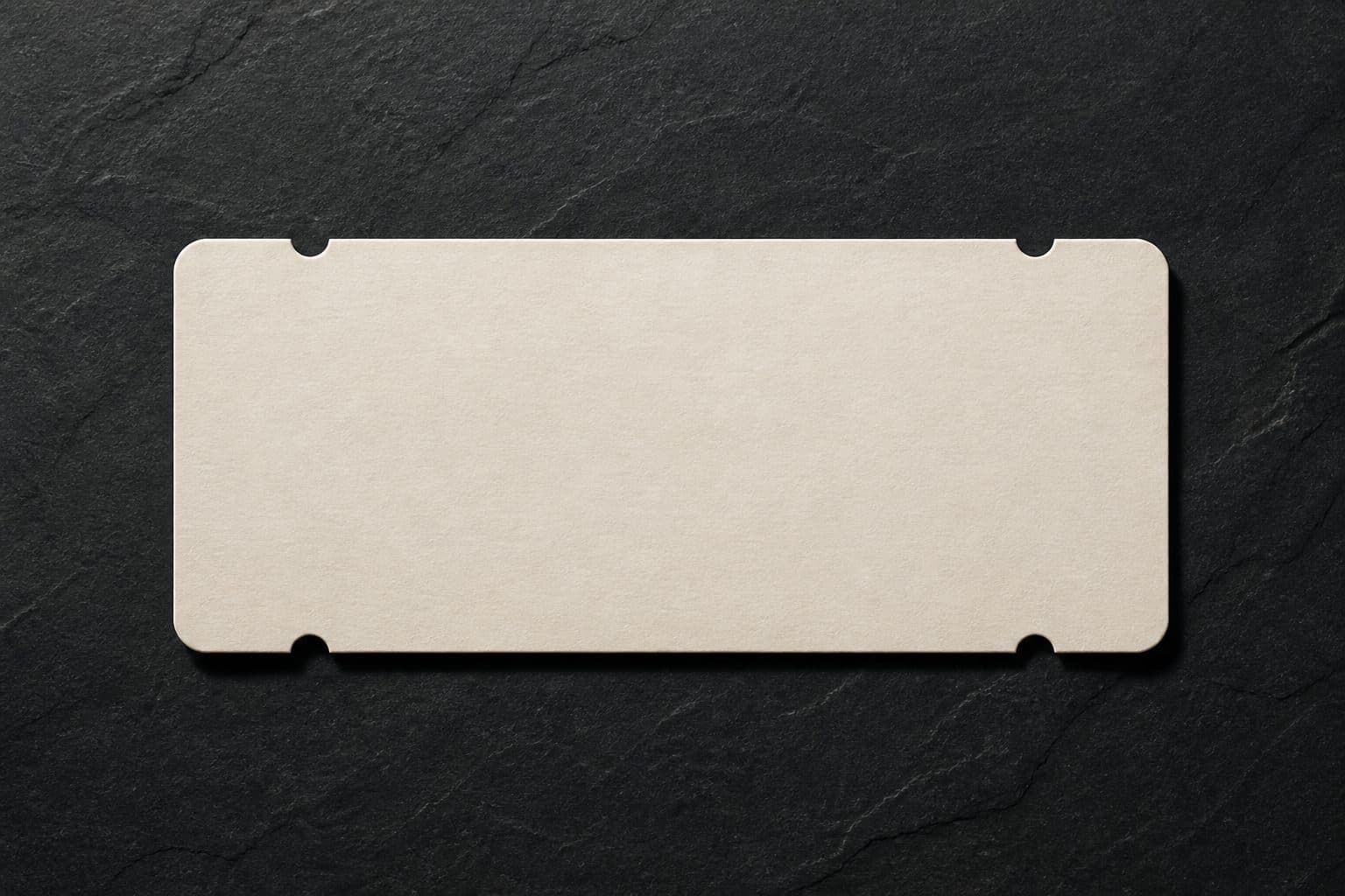 Single blank airline ticket on a dark slate surface